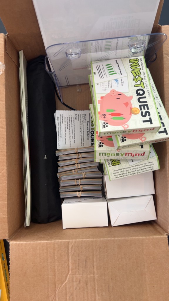 InvestQuest games, cards, and lesson materials packed for a workshop