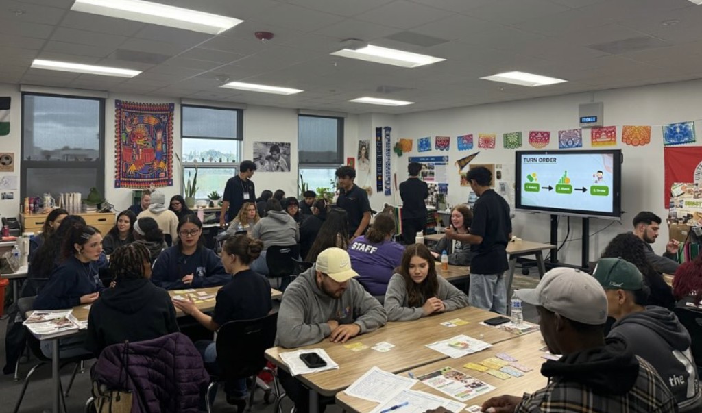 Educators playing InvestQuest during a professional development session